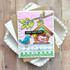 Handmade greeting card with two doodle birds in a birdhouse with home tweet home sentiment with cardstock in background.