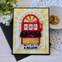 Handmade greeting card with a slot machine on it with you're one in a million sentiment on it with flowers in background.