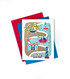 Handmade greeting card with a beach theme including a crab and sail boat with sending good vibes sentiment on it and cardstock in the background.