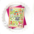 Handmade greeting card that is carnival themed with sending big top birthday wishes sentiment on it with cardstock in background.