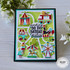 Handmade greeting card that is carnival themed with sending big top birthday wishes sentiment on it with cardstock in background.