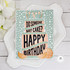 Handmade greeting card with layered cake on it with citrus fruit with did someone say cake? Happy birthday sentiment on it with flowers in background.