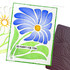 Handmade greeting card with a flower on it and so happy for you sentiment with crafting materials in background.