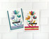 Two handmade greeting cards with flowers on them both, one is cool tones and one in warm tones with one having celebrating you sentiment on it and the other having thinking of you sentiment on it.