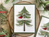 Handmade greeting card with tree on it with with ornaments and cardinal on it with all is calm, all is bright sentiment on it.