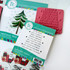 Red rubber stamp included in O Christmas Tree Cardmaking kit that includes different christmas themed sentiments.