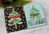 Two handmade greeting cards with trees on it and one with may your days be merry sentiment on it and the other with merry christmas sentiment on it.