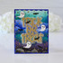 Handmade greeting card with clouds, ghosts, and bats on it with trick or treat sentiment on it.