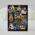 Handmade greeting card with haunted house, monsters and pumpkins on it with haunted hello sentiment on it.
