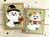 Two handmade greeting cards with ghosts on them and both with the sentiment boo on them.