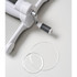Two clear circular die cutting plates on a white table next to a die cutting machine.