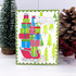 Handmade greeting card with sled with presents on it and season's greeting sentiment on it.
