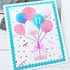 Handmade greeting card with balloons holding a present up with 17 on one of the balloons.