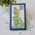 Handmade greeting card with a scooter on it holding presents with happy birthday to you sentiment on it.