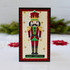 Handmade greeting card with a nutcracker on it and merry Christmas sentiment on it.