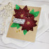 Handmade greeting card with flowers on it and season's greetings sentiment on it.