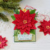 Handmade greeting tag with a flower on it and season's greetings sentiment on it.