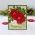 Handmade greeting card with flowers on it and merry Christmas sentiment on it.