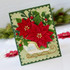 Handmade greeting card with flowers on it and merry Christmas sentiment on it.