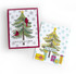 Two handmade greeting cards with Christmas trees on each and different holiday sentiments on each