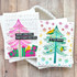 Two handmade greeting cards with Christmas trees on each with different holiday sentiments on each.