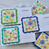 Three handmade calendars with flowers on each.