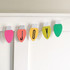 Handmade garland with the word "joy" on it made out of light bulb die cut paper.