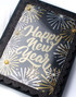 Handmade greeting card with fireworks on it and happy new year sentiment on it.