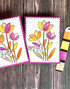 Two handmade greeting cards with flowers on them and a color swatch palette next to it.