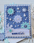 Handmade greeting card with snowflakes on it and warm wishes sentiment on it.