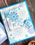 Handmade greeting card with snowflakes on it and let it snow sentiment on it.
