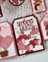 Handmade gift tag with hearts on it and sending hugs sentiment on it.