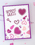 Handmade greeting card with hearts on it and a key with sending hugs sentiment on it.