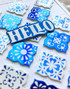 Handmade greeting card with tiles on it and hello sentiment on it.