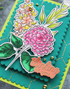 Close up of handmade greeting card with flowers on it.