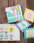 Handmade greeting tags and box with birthday items on each.