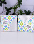 Two handmade gift boxes with flowers on each.