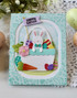 Handmade greeting card with a bunny on it in a basket and hoppy easter sentiment on it.