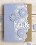 Handmade greeting card with flowers on it and hello sentiment on it.