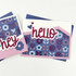 Handmade greeting card with flowers on it and hello sentiment on it.