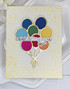 Handmade greeting card with balloons on it and celebrating you sentiment on it.