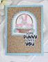 Handmade greeting card with leaves on it and a bunny with some bunny loves you sentiment on it.