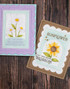 Two handmade greeting cards with flowers on each and sentiments that are plant themed on both.