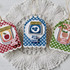 Three handmade greeting tags with jams and different sentiments on each.