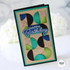 Handmade greeting card with circles on it and happy birthday sentiment on it.