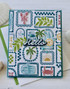 Handmade greeting card with summer beach themed items on it and hello sentiment on it.