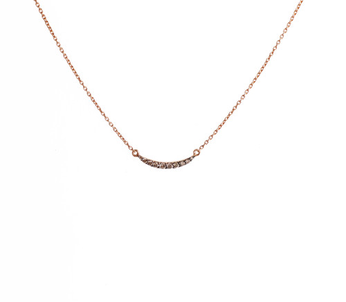 This 18k rose gold arc necklace featuring brown diamonds is from the Fine Jewelry Mewar Collection.