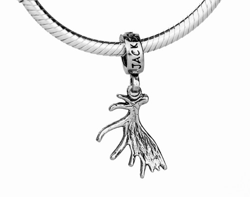 This handmade moose antler charm in sterling silver is from the locally made Teton Jewelry Collection.