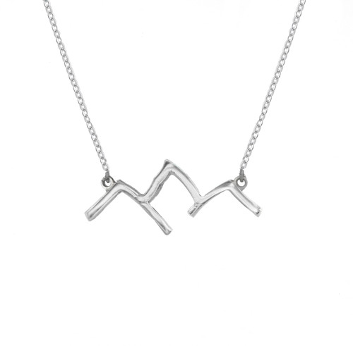 This handmade Grand Teton Mountain Range outline necklace in sterling silver with an adjustable rolo chain is from the locally made Teton Jewelry Collection.