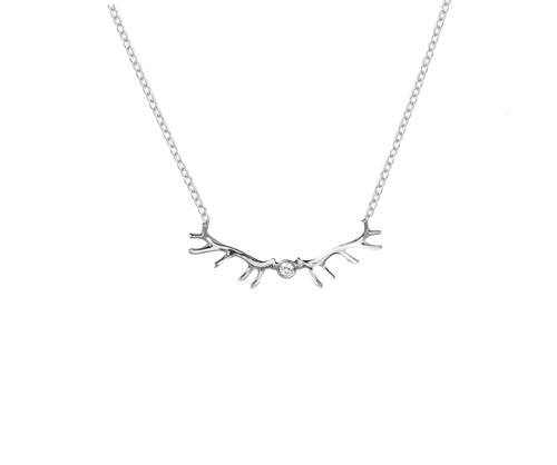 This handmade elk antler pendant necklace in sterling silver featuring a 2mm crystal and a 1.65mm sterling silvr rolo adjustable chain is from the locally made Teton Jewelry Collection. Exclusively made for and sold at A Touch of Class.